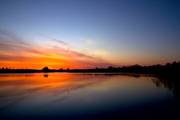 Fototapeta na wymiar Sunset in the twilight and a beautiful blue sky