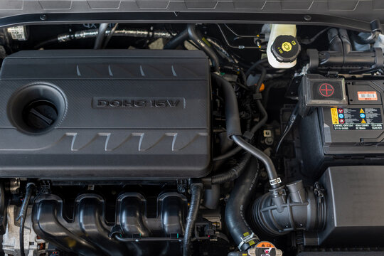 Atmospheric gasoline 4-cylinder DOHC 16V engine of modern Hyundai Venue SUV close-up with other units of engine compartment. Top view. Ukraine, Zhytomyr, February 19, 2024