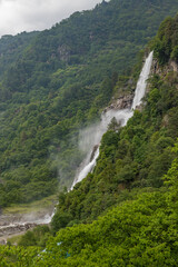 Jang falls also known as nuranang falls or bong bong falls some 100 metres high waterfall it falls into nuranang river and engulfed by mountains in tawang district Arunachal Pradesh state of India. - obrazy, fototapety, plakaty