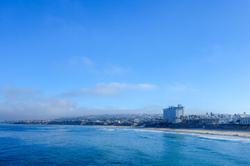 Early morning at Pacific Beach surrounded by seaside hotels and recreational areas as seen from Crystal Pier in San Diego, Southern California