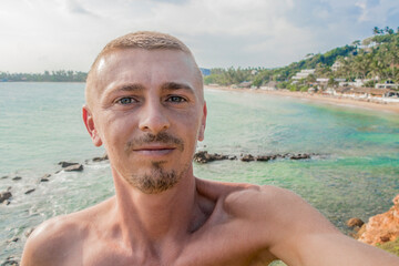 Parrot Rock on tropical paradise beach Mirissa Beach Sri Lanka.