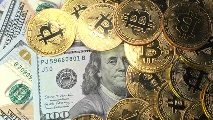 Golden physical Bitcoin coins on US dollars close up, rotating money background. Electronic crypto currency. Savings and investments concept. - Powered by Adobe