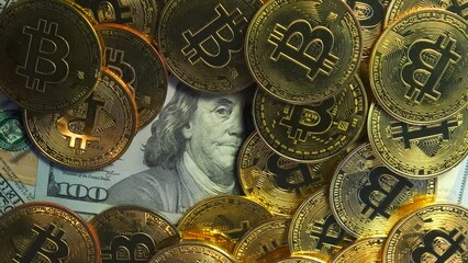 Concept of competition between digital money bitcoin and dollar. Crypto currency coins on US 100 dollar bills. - Powered by Adobe
