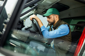 Truck driver feeling tired during the ride.