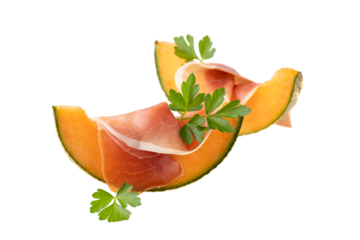 Traditional spanish  jamon slice (dried pork meat) with orange sweet melon ( cucumis melo) nd fresh parsley leaves isolated on white