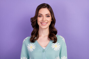 Portrait photo of young optimistic lady brunette wavy hairstyle wearing blue shirt daisy print...