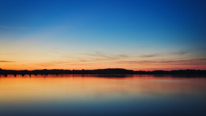 See im Abendrot - Sunset - Landscape - Beautiful Sunset scene over the lake and silhouette hills in...