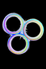 three multi-colored circles are shown in front of a black background