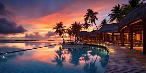 Fototapete Rund Maldives at a resort on the island at sunset. © Wararat