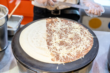 Making chocolate and cheese crepes