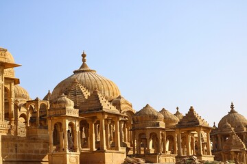 he regal cenotaphs, also known as Jaisalmer Chhatris, stand majestically at Bada Bagh in Jaisalmer, Rajasthan, India - obrazy, fototapety, plakaty
