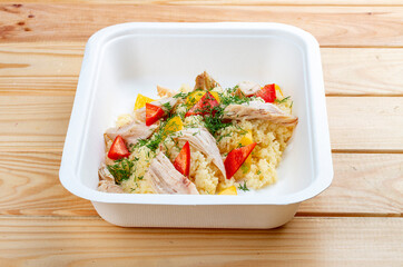 Turkey bulgur. Healthy food. Takeaway food.  On a wooden background.