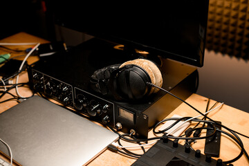 Close-up of recording studio desktop with monitor and other music recording equipment
