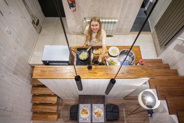A woman cooking on the kitchen