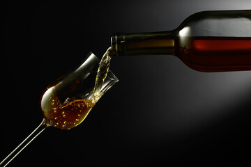 Glass of premium alcohol on a black background.