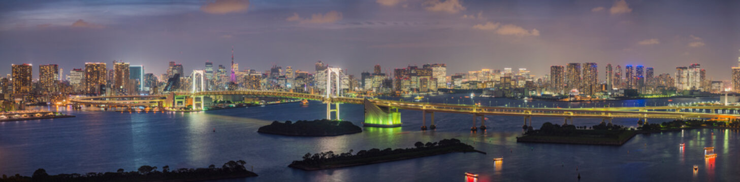 Panoramic View of the Rainbow Bridge crossing northern Tokyo Bay between Shibaura Pier and the Odaiba waterfront development in Minato, Tokyo, Kanto region, Japan.