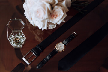 Men's accessories, groom details. Watch. Men's perfumes. Preparation for the wedding. Leather...