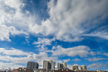  Clear blue skies over the modern skyline of Upper Manhattan, viewed from the serene shores of Edgewater, NJ.