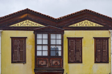 old wooden house and balcony with window at cesme