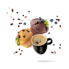 Fresh baked chocolate chips muffin with mint leaves and black cup hot espresso coffee flying isolated on white background.