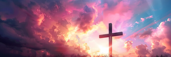 Cross of Jesus Christ on sunset sky background. Christian religion concept.