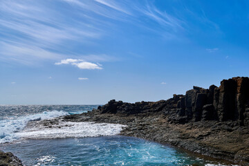 Fototapeta na wymiar Natural swimming pool in Caleta de Fuste, Fuerteventura, Spain, Atlantic Ocean and huge volcanic rocks