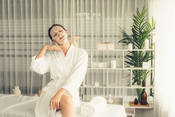 Serene modern daylight ambiance of spa salon, woman customer posing and indulges in rejuvenating...