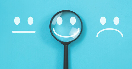 Customer feedback and customer service concept, magnifying focus on smile face icon, Excellent Face and Rating for a satisfaction survey.