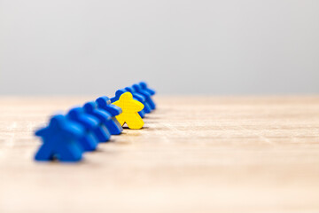 Leadership Concept with Yellow Game Piece Leading