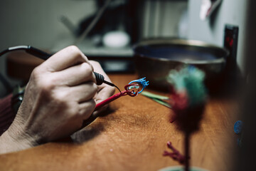 Making wax tree jewelry befor casting,process of making jewelry. Close up photo of hand and...