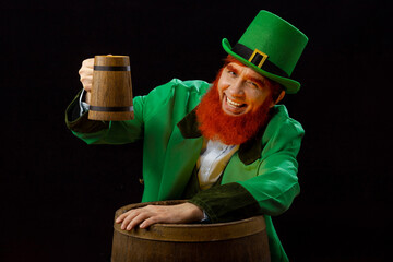 Leprechaun elf on St. Patrick's Day. Cheerful character Irish leprechaun for advertising with a red...