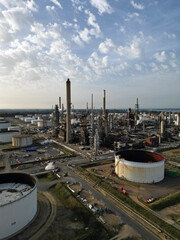 UK petrochemical complex with chimneys, pipelines and oil storage tanks at oil refinery in Fawley,...