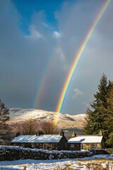 Two rainbows with dark blue sky