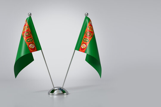 Double Turkmenistan Table Flag on Gray Background. 3d Rendering