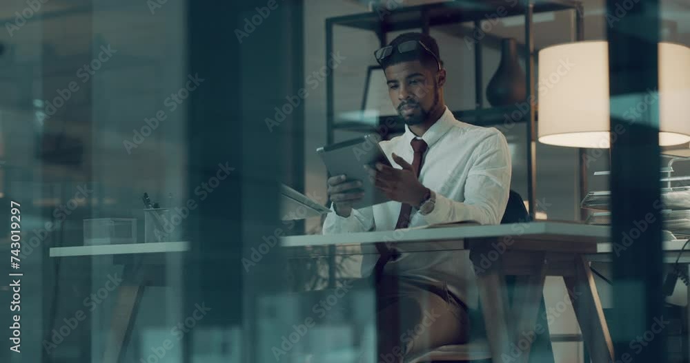 Poster Business man, reading on tablet and computer at night for stock market investment, data analytics and planning in office. Professional broker or trader with digital technology solution and analysis