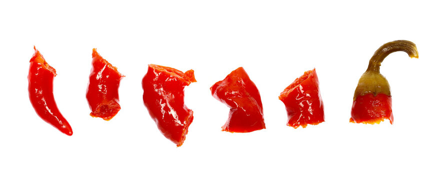Hot, suor red pepperoni pepper slices isolated on white background, top view
