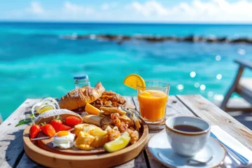 Gordijnen Luxury breakfast food on wooden table, with beautiful sea background. © venusvi