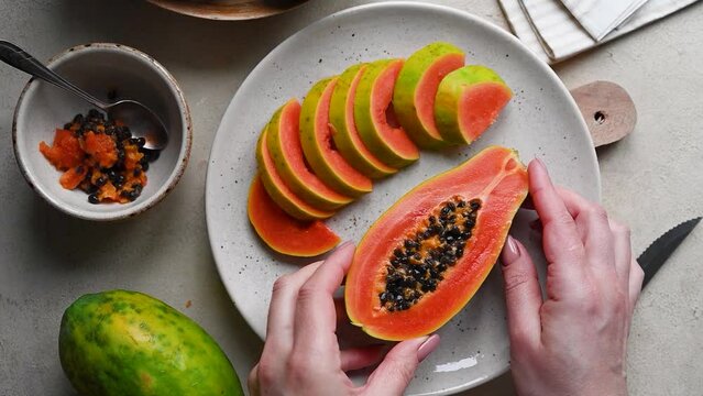 Papaya fruit, sliced fresh papaya fruit with seeds
