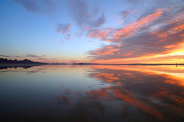 Fototapeta na wymiar Sunrise at Bonneville Salt Flats with spectacular water reflections near Wendover Utah Unit4ed States