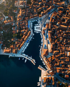 Aerial view of Cres, a beautiful coastal town with a historic harbor and orange rooftops, Primorje-Gorski Kotar, Croatia.