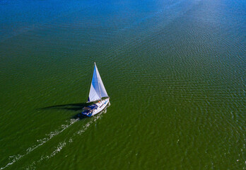 Aerial view of Indian River Lagoon with sailboats and clear blue waters, Sebastian, Florida, United States.