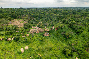 Aerial view of Bono East Region with green forest and rocks, Ghana.