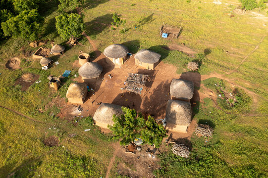 Aerial view of traditional village with huts and sustainable farming in the savannah region, Ghana.