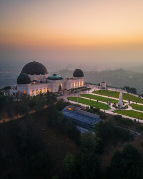 Aerial view of illuminated Griffith Observatory and scenic Los Angeles skyline, California, United States.
