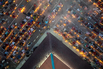 Aerial view of a Muslim community gathering for evening prayers in a modern cityscape, Dhaka Division, Bangladesh.