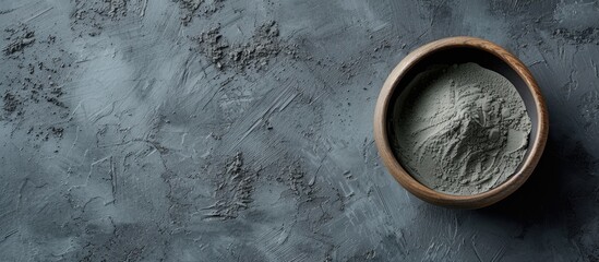 Blue gray bentonite clay in the bowl Clay texture close up Diy mask and body wrap recipe Natural...