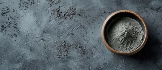 Keuken foto achterwand Schoonheidssalon Blue gray bentonite clay in the bowl Clay texture close up Diy mask and body wrap recipe Natural beauty treatment and spa Top view copy space. with copy space image. Place for adding text or design
