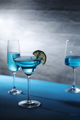 Glasses with blue alcohol cocktail ready for a party