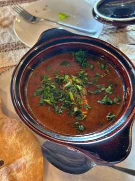 classic bowl with a ceramic lid, baking bowl, Georgian bread, pot with Georgian goulash, spicy ostri goulash