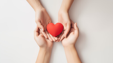 Family hands holding red heart, heart health insurance, organ donation, happy volunteer charity